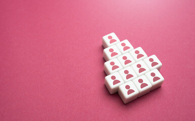 Blocks with people in the shape of an arrow. Cooperation teamwork. Forming into an organized group....