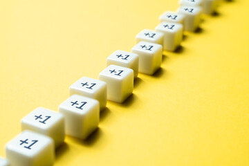 Sequential chain of blocks with plus one. Sequence. Arithmetic progression. Add one more. Increase...