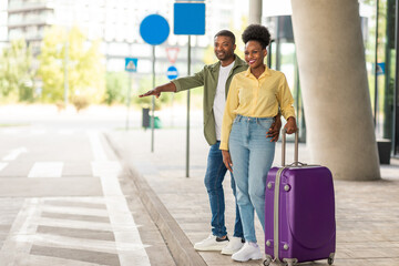 Happy Black Tourists Couple Hailing Taxi Stopping Cab Standing Outside
