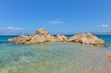 Fototapeta na wymiar small cove with crystal clear water on Dodo Beach in Ardic (Cesme, Izmir region, Turkey)