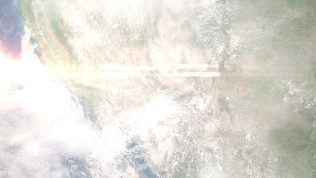 Earth zoom in from outer space to city. Zooming on Payson, Arizona, USA. The animation continues by zoom out through clouds and atmosphere into space. Images from NASA
