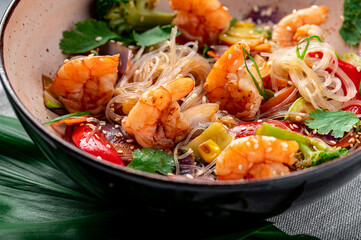 Rice noodles with shrimp and vegetables. Asian cuisine.