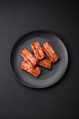 Grilled fresh juicy ribs with salt, spices and herbs