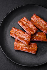 Grilled fresh juicy ribs with salt, spices and herbs