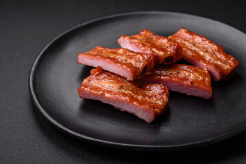 Grilled fresh juicy ribs with salt, spices and herbs