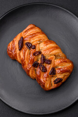 Delicious fresh baked pigtail bun with nuts and syrup