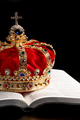 A Gold Crown with Red Velevet on a Bible
