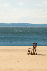 wooden chair on the beach