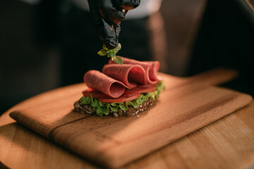 Professional shooting of food in advertising and cinema. Close-up. The work of a food stylist on the set.