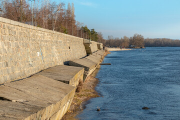 Naklejka premium Ruined embankment on the banks of the Dnieper river in Kremenchuk city, Ukraine