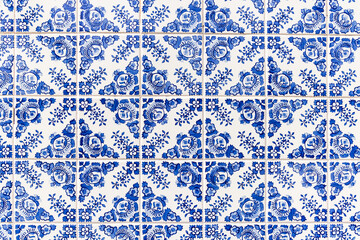 Traditional hand painted azulejos decorative tiles on a building in Porto.