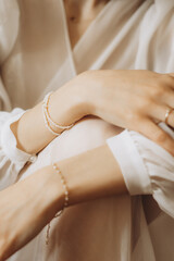fragile hands of a young woman in a photo with a shallow depth of field, tenderness and lightness, femininity and aesthetics in a photo of women's hands