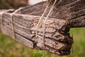 a string keeping together a broken fence