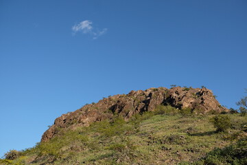 Fototapeta premium rocky desert mountain landscape with blue sky and clouds