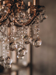 Vintage chandelier, romantic dark tone, crystals shining,gray background