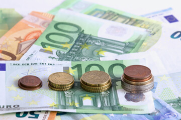 Save money and investment concept with coin stack growing. Top view with money background 