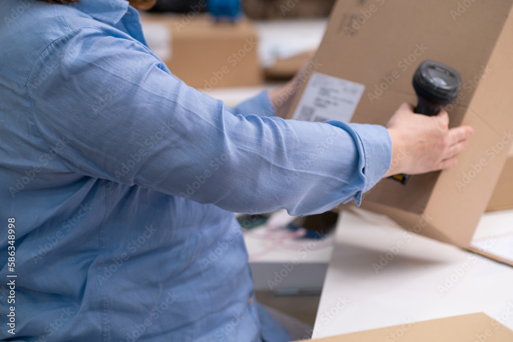 Poster logistic shipping online orders concept. close up scanning barcode on package delivery, e-commerce