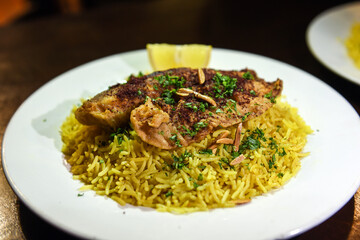 dish of rice with spices with chicken served in a delicious way
