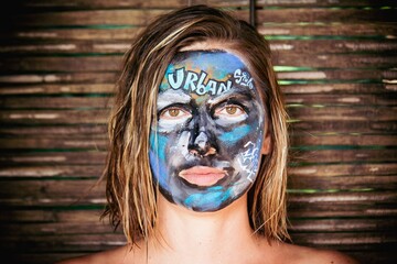 portrait of a woman with a painted face graffiti street art urban smile eyes beautiful scary artistic