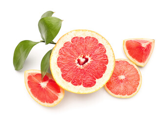 Juicy grapefruits and plant branch on white background