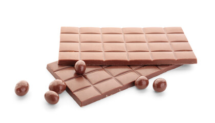 Tasty chocolate bars and candies on white background