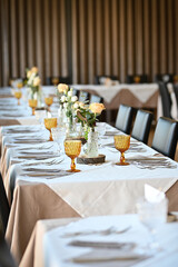 Beautiful table set for an event party or wedding reception. Restaurant interior