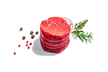 Raw Ribeye steak with spices and herbs isolated on white background. Trendy hard light, dark shadow