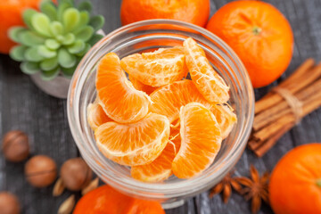 peeled tangerine on wood background