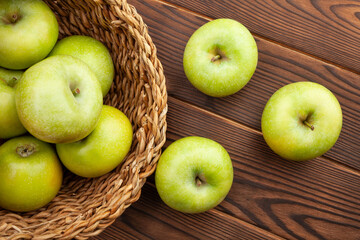 green apples on wood background
