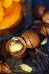 peeled macadamia nut on wood background