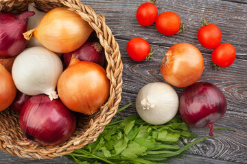 colorful onions on wood background