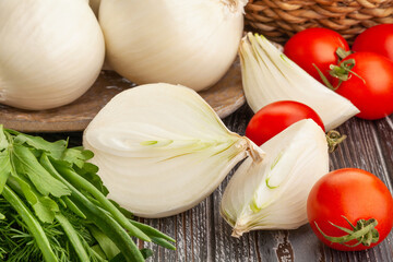 sliced white onions on wood background
