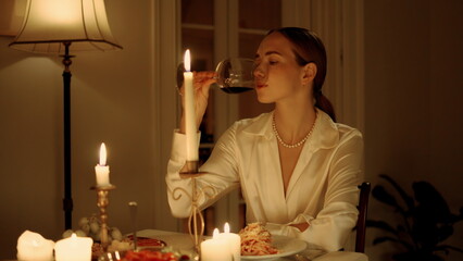 Elegant lady tasting wine glass romantic dinner closeup. Woman drinking alcohol