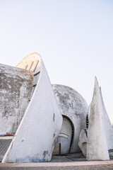 Futuristic white concrete building, flowing building. Kyiv crematorium.