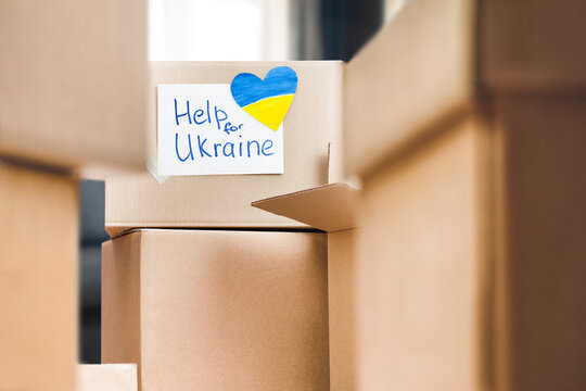 heap of cardboard boxes with humanitarian aid for Ukraine