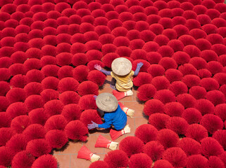 A worker working with incense pattern texture background in Asia, Vietnam. People lifestyle.