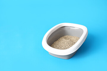 Litter box for cat on blue background