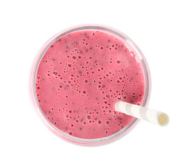 Glass of tasty pink smoothie with straw on white background