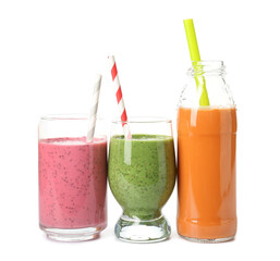 Glasses and bottle of different tasty smoothie with straws on white background