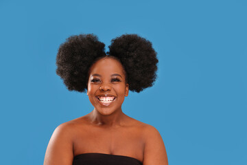 Real positive emotions. Happy, authentic afro woman laughing and looking at camera
