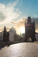 Beautiful view of Old Town Tower of Charles Bridge at dawn in Prague, Czech Republic