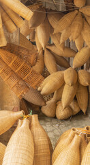 Fototapeta na wymiar Weaving bamboo fish trap with basket in Hanoi, Vietnam.