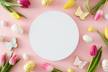 Fototapeta na wymiar Easter decor concept. Top view composition of white circle colorful easter eggs yellow pink tulips flowers and butterfly cookies on pastel pink background with blank space