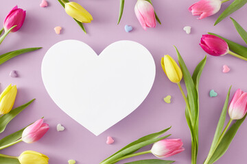 Mother's Day concept. Creative layout made of white heart yellow pink tulips flowers and colorful hearts baubles on isolated lilac background. Flat lay blank space