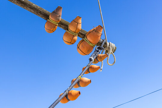 Clay pots, known as buzio, on a traditional windmill. The sound of the wind in the buzio help the miller control the mill.