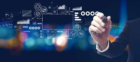 Digital transformation and technological revolution concept with businessman in a city at night