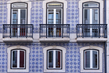 Typical ceramic tiled blue and white azulejos tiles on a building.