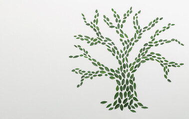 Tree silhouette made of green Leaves on white Background. Creative natur concept. Aesthetic flat lay with copy space.