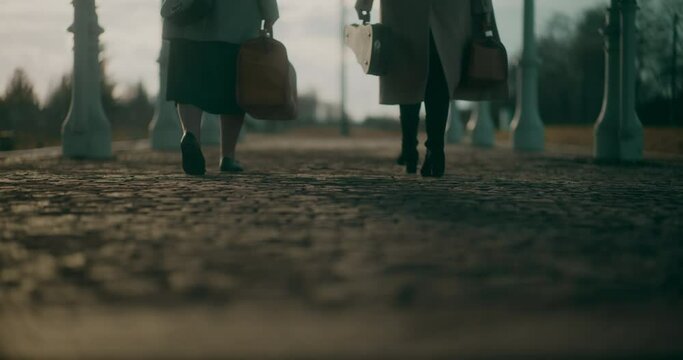 Two Women Walking at Railway Station