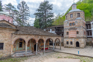 view of an inner courtyard of the famous troyan monastery in Bulgaria - obrazy, fototapety, plakaty
